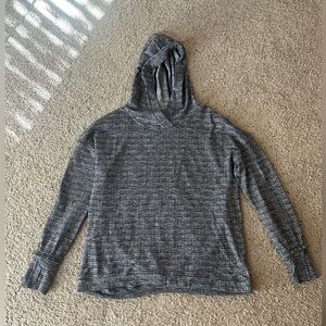 Lululemon pullover with hood, ruffles sleeves, pleated back.